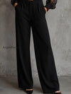 elegant-black-lapel-sheer-puff-sleeve-wide-leg-jumpsuit